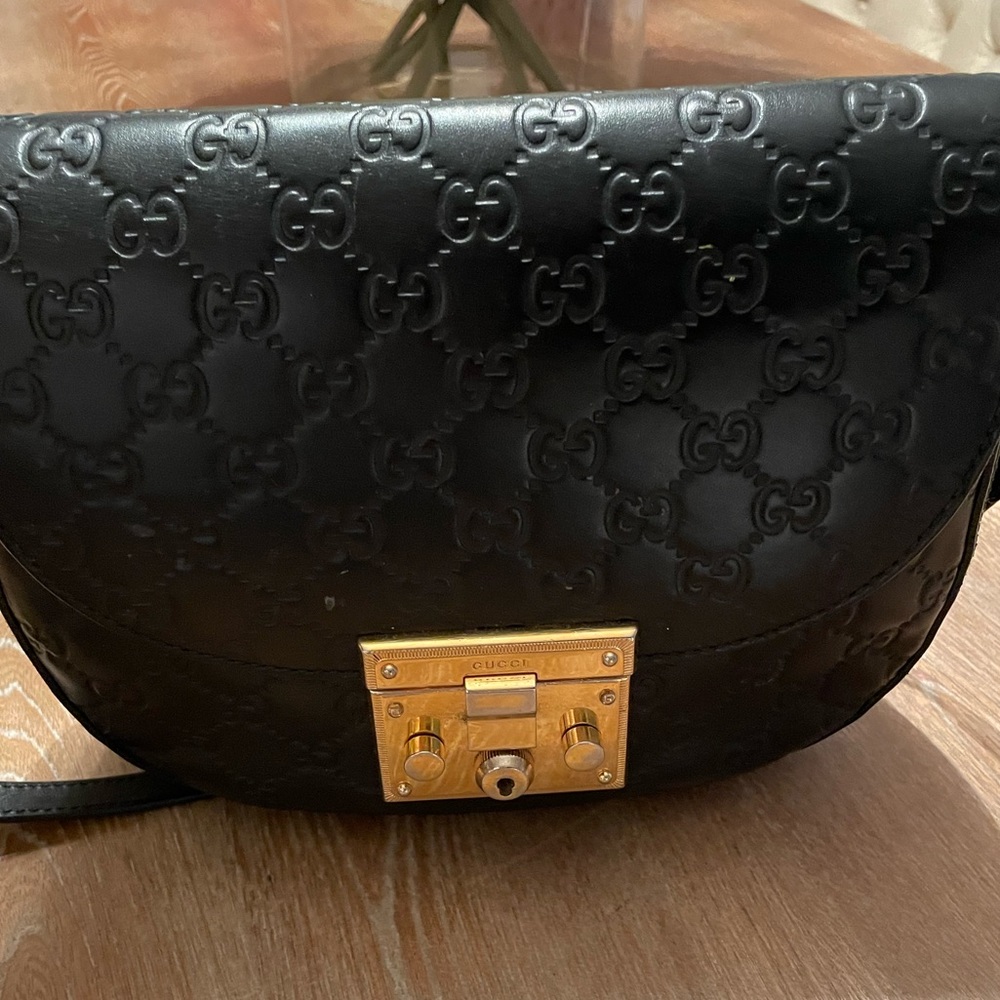 Gucci purse black embossed, leather
